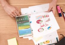 Arrivalist Provides Independent Measurement for Samsung Ads Smart TV Travel and Tourism Advertising Campaigns person holding white Samsung Galaxy Tab